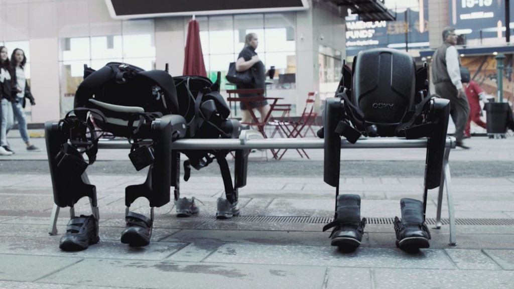 Watch a robot help a paralyzed man walk