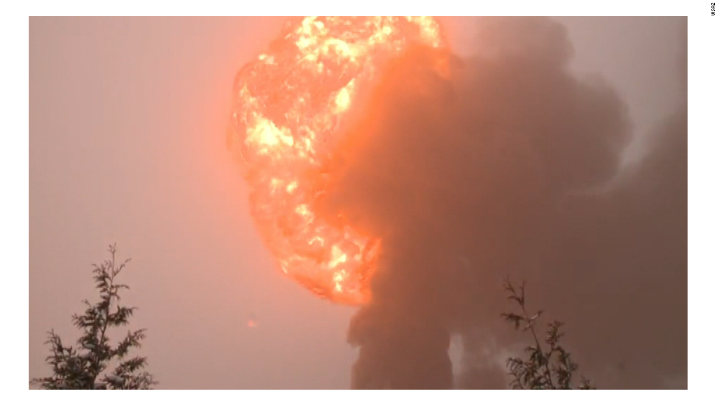 Train carrying oil derails and bursts into flames