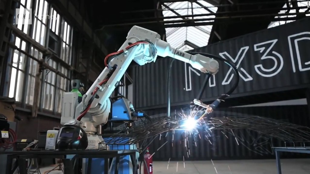 Watch robots 3D print a bridge