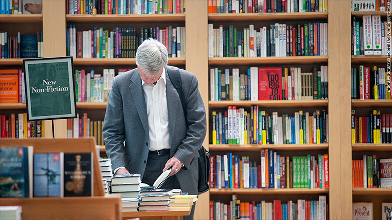 man browsing books bookstore