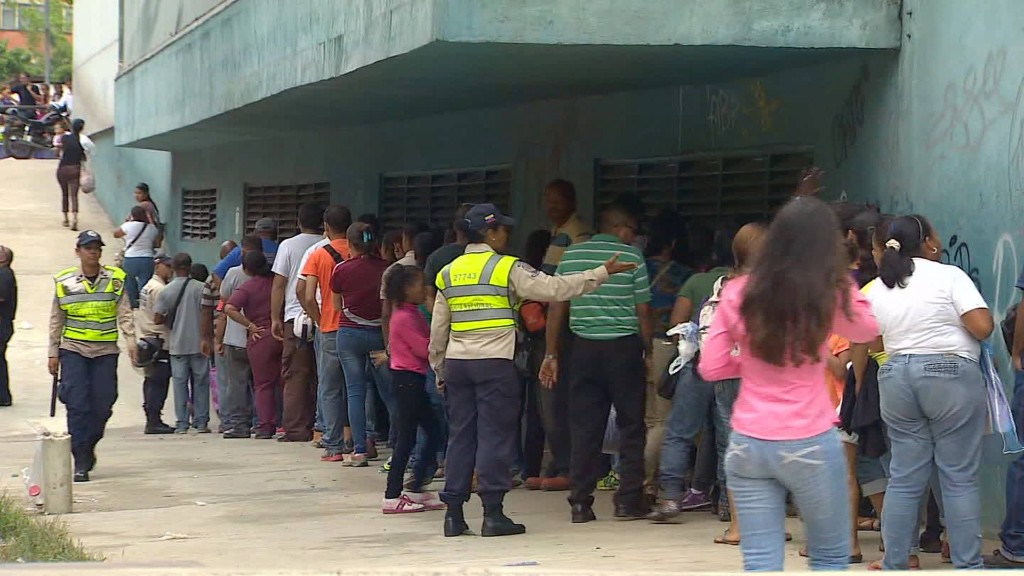 Venezuelans wait on hours-long line for basics