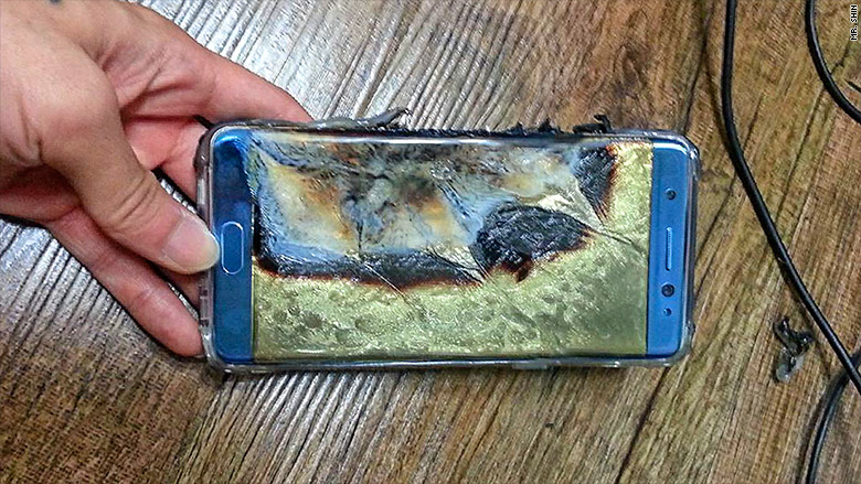 A mobile phone that has been affected by a battery malfunction and is left burnt and destroyed.