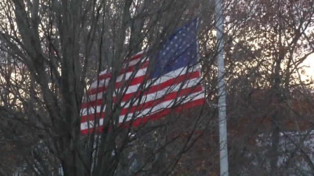 Students lower flag in election protest 