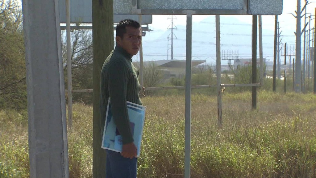 Workers wait as the plant in Mexico expands