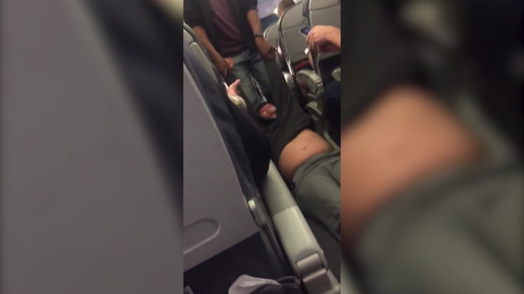 Man dragged off overbooked United flight