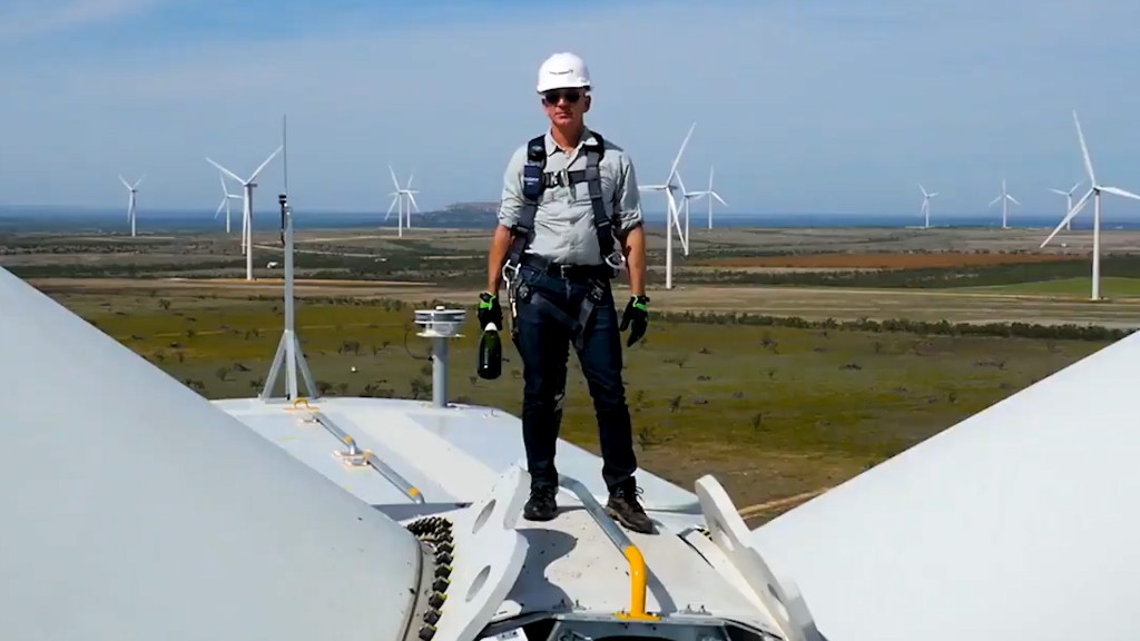 Jeff Bezos smashes bottle on top of wind turbine