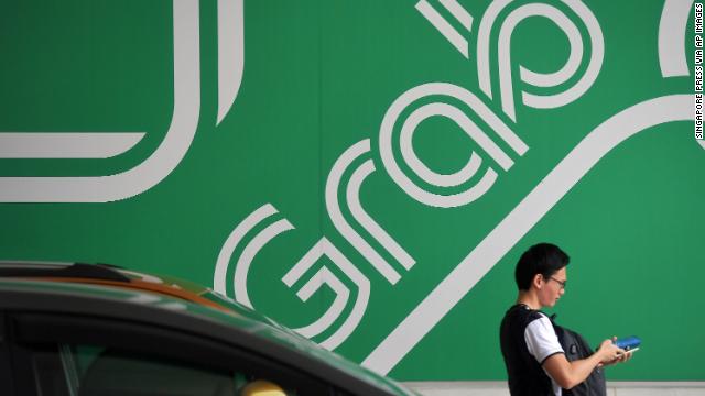 Singapore says Uber may have to unwind merger with Grab