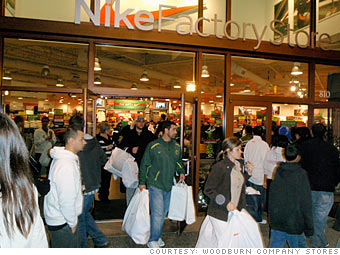 Consumers line up outside Nike