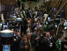 Stocks swing into Friday